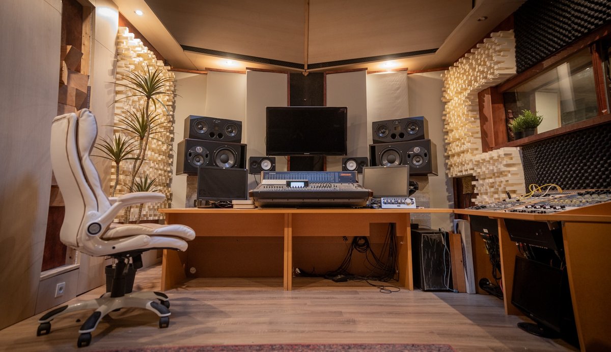 Audio production desk with studio monitors